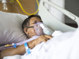 Man with respiratory breather help on