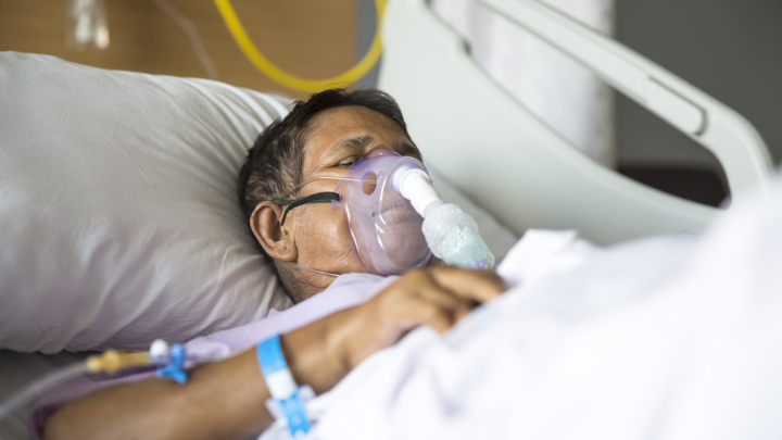 Man with respiratory breather help on